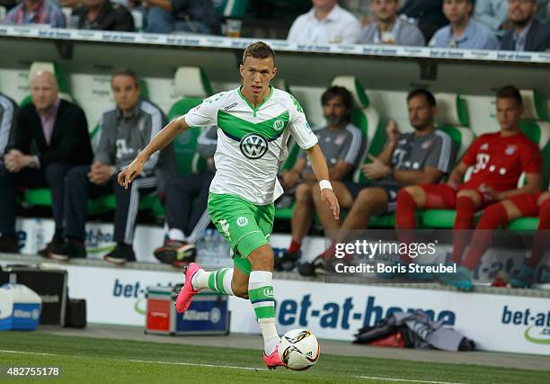 Ivan Perisic of VfL Wolfsburg runs with the ball during the DFL Supercup 2015 match between VfL Wolfsburg and FC Bayern Muenchen at Volkswagen Arena...