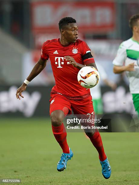 David Alaba of FC Bayern Muenchen runs with the ball during the DFL Supercup 2015 match between VfL Wolfsburg and FC Bayern Muenchen at Volkswagen...