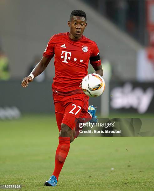 David Alaba of FC Bayern Muenchen runs with the ball during the DFL Supercup 2015 match between VfL Wolfsburg and FC Bayern Muenchen at Volkswagen...