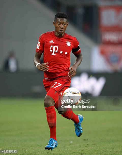 David Alaba of FC Bayern Muenchen runs with the ball during the DFL Supercup 2015 match between VfL Wolfsburg and FC Bayern Muenchen at Volkswagen...