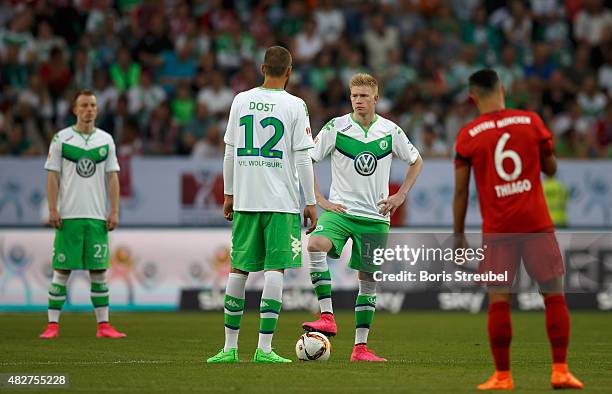 Kevin De Bruyne and Bas Dost of VfL Wolfsburg wait for kickoff during the DFL Supercup 2015 match between VfL Wolfsburg and FC Bayern Muenchen at...