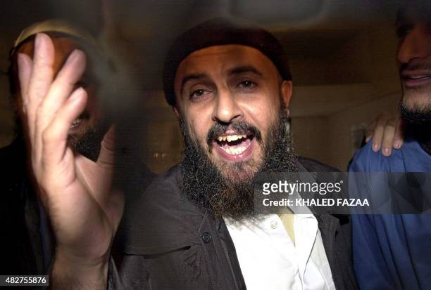Jamal al-Badawi, a suspect of the USS Cole destroyer's bombing in 2000 in the Yemeni port of Aden, gestures after an appeal court announced his...