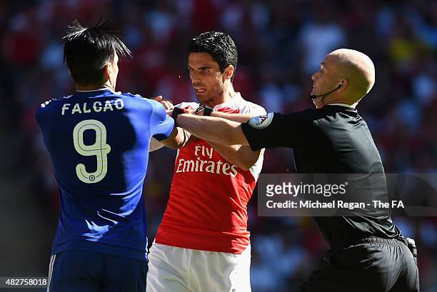 Referee, Anthony Taylor splits up Radamel Falcao Garcia of Chelsea and Mikel Arteta of Arsenal during the FA Community Shield match between Chelsea...