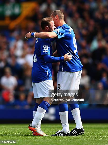 Wayne Rooney of Everton and Manchester United with Duncan Ferguson of Everton at the end of the Duncan Ferguson Testimonial match between Everton and...