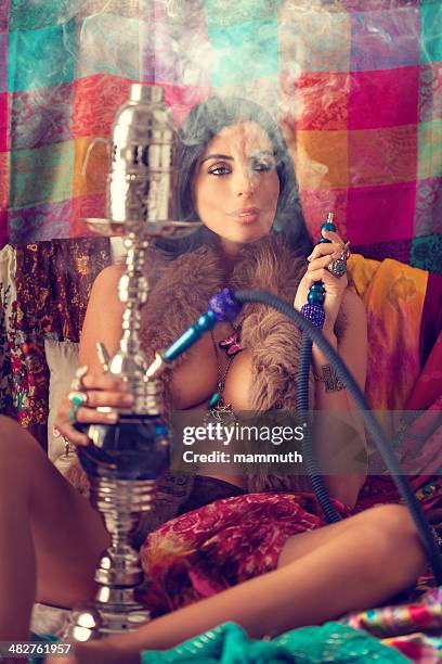 hippie girl smoking water pipe - shisha smoke stock pictures, royalty-free photos & images
