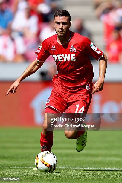 Jonas Hector of Koeln runs with the ball during the Colonia Cup 2015 match between 1. FC Koeln and FC Valencia at RheinEnergieStadion on August 2,...