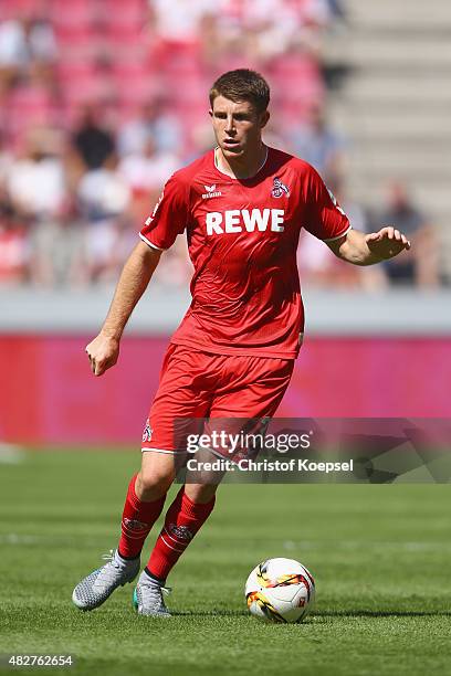 Dominik Heintz of Koeln runs with the ball during the Colonia Cup 2015 match between 1. FC Koeln and FC Valencia at RheinEnergieStadion on August 2,...