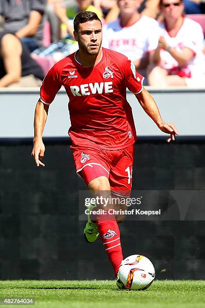 Jonas Hector of Koeln runs with the ball during the Colonia Cup 2015 match between 1. FC Koeln and FC Valencia at RheinEnergieStadion on August 2,...