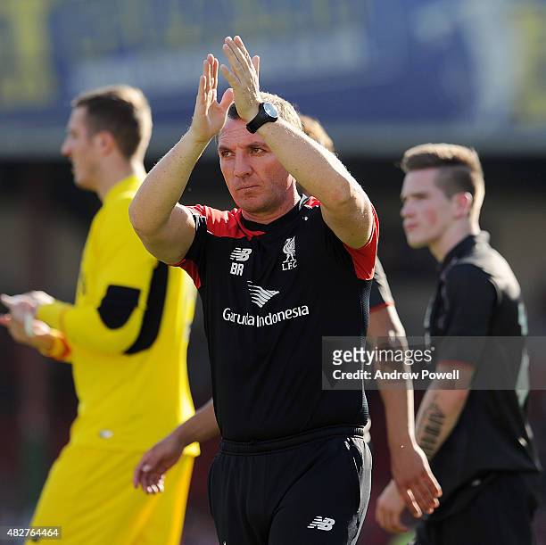 Brendan Rodgers manager of Liverpool shows his appreciation to the fans at the end of a preseason friendly at County Ground on August 2, 2015 in...