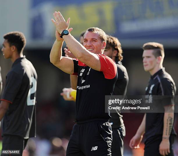 Brendan Rodgers manager of Liverpool shows his appreciation to the fans at the end of a preseason friendly at County Ground on August 2, 2015 in...