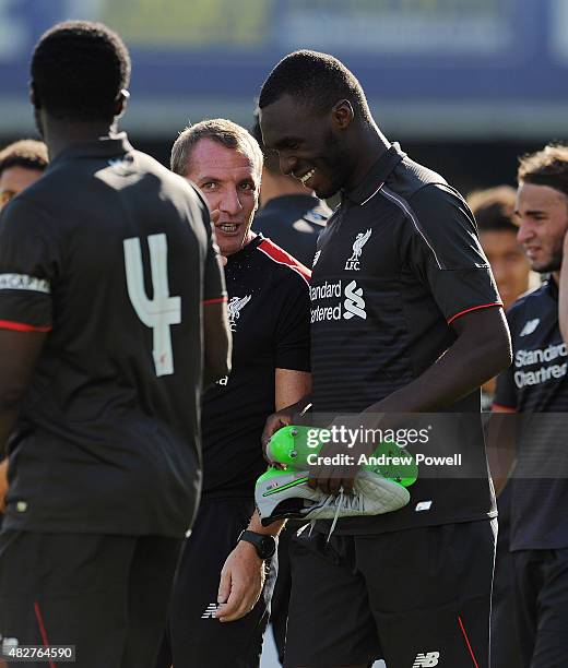 Brendan Rodgers manager of Liverpool laughs with Christain Benteke at the end of a preseason friendly at County Ground on August 2, 2015 in Swindon,...