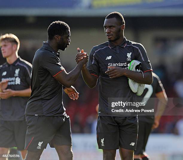 Christian Benteke and Kolo Toure of Liverpool at the end of a preseason friendly at County Ground on August 2, 2015 in Swindon, England.