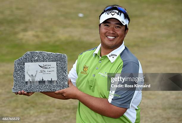 Aphibarnrat of Thailand with the winners trophy after his match against Robert Karlsson of Sweden in the final of the Saltire Energy Paul Lawrie...