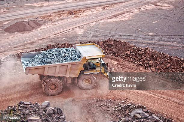 dumper truck on road in surface mine quarry - mineral mine stock pictures, royalty-free photos & images