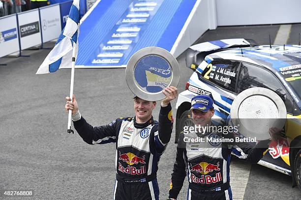 Jari Matti Latvala of Finland and Mikka Anttila of Finland celebrate their victory during Day Three of the WRC Finland on August 2, 2015 in...