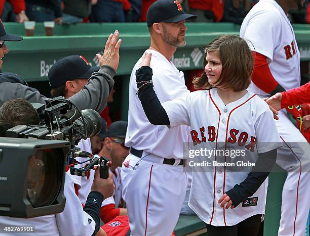 People affected by the Boston Marathon bombing last year were honored during the pre-game ceremony on opening day, including Jane Richard, who lost a...