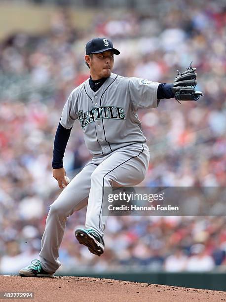 Hisashi Iwakuma of the Seattle Mariners delivers a pitch against the Minnesota Twins during the first inning of the game on August 2, 2015 at Target...