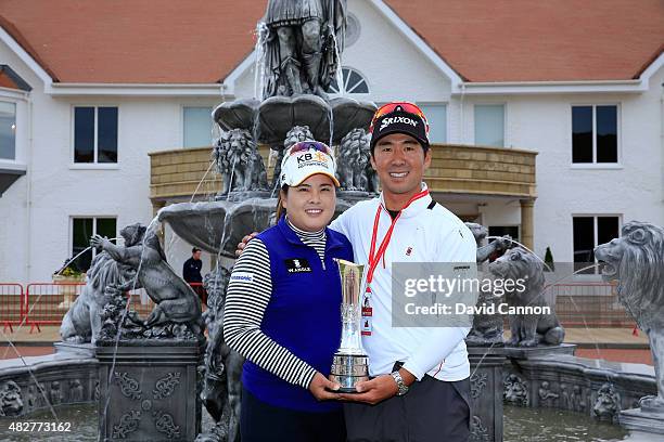 Inbee Park of South Korea proudly holds the trophy outside the Clubhouse with her husband Gi Hyeob Nam after her victory in the 2015 Ricoh Women's...