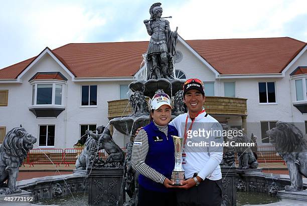 Inbee Park of South Korea proudly holds the trophy outside the Clubhouse with her husband Gi Hyeob Nam after her victory in the 2015 Ricoh Women's...