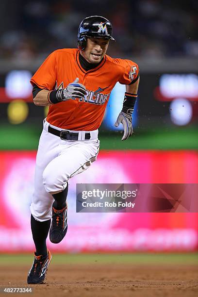 Ichiro Suzuki of the Miami Marlins runs to third base during the first inning of the game against the San Diego Padres at Marlins Park on August 2,...