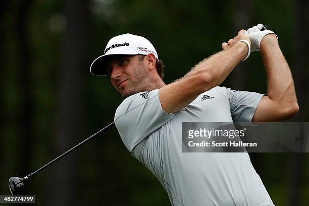 Dustin Johnson of the United States watches a tee shot during round one of the Shell Houston Open at the Golf Club of Houston on April 3, 2014 in...