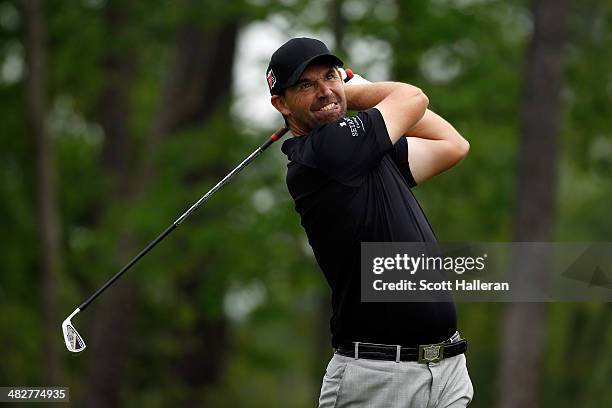 Padraig Harrington of Ireland watches his tee shot on the ninth hole during round one of the Shell Houston Open at the Golf Club of Houston on April...