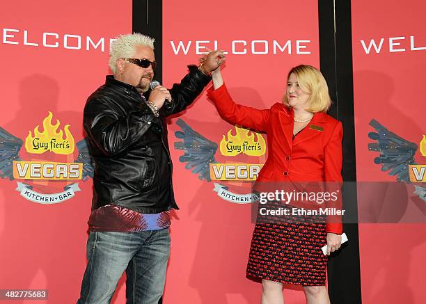 Chef and television personality Guy Fieri and Regional President of The Quad Resort & Casino Eileen Moore talk to guests during a welcome event for...