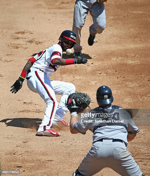 Alexei Ramirez of the Chicago White Sox is caught in a run-down as Brian McCann of the New York Yankees takes the throw in the 2nd inning at U.S....
