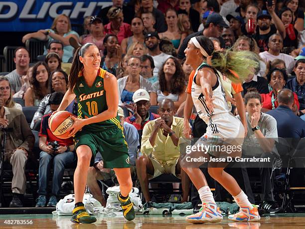 Epiphanny Prince of the New York Liberty handles the ball against Candice Wiggins of the New York Liberty on August 2, 2015 at Madison Square Garden...