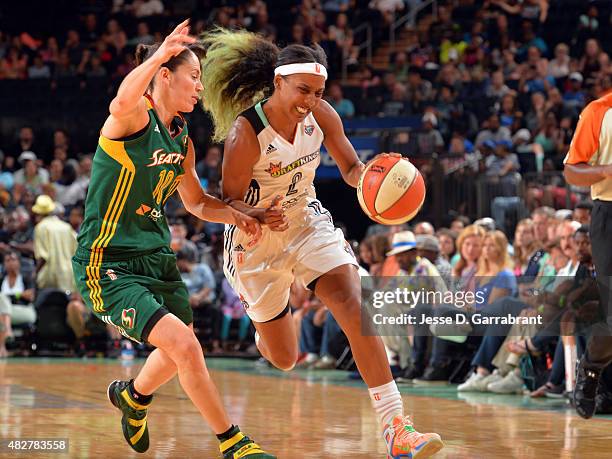 Candice Wiggins of the New York Liberty drives to the basket against Sue Bird of the Seattle Storm on August 2, 2015 at Madison Square Garden in New...