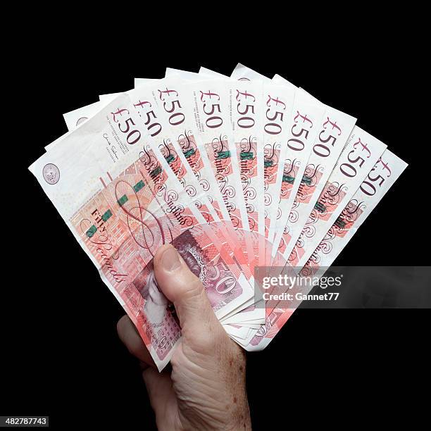 five hundred pounds in fifty pound notes - 50 pound notes stock pictures, royalty-free photos & images
