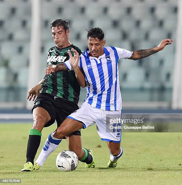 Federico Peluso of Sassuolo and Gianluca Lapadula of Pescara in action during the preseason friendly match between Pescara Calcio and US Sassuolo...