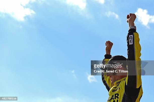Matt Kenseth, driver of the Dollar General Toyota, celebrates in Victory Lane after winning the NASCAR Sprint Cup Series Windows 10 400 at Pocono...