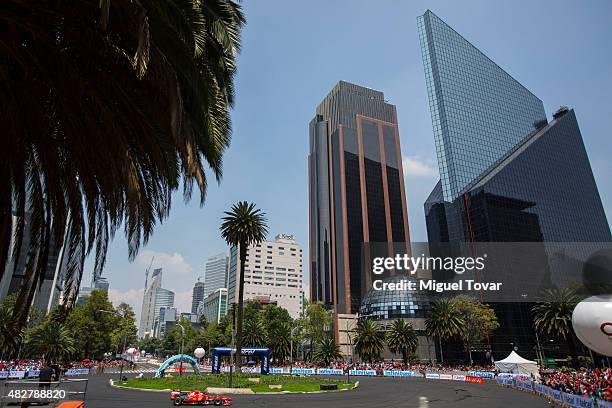 Mexican driver of F1 Esteban Gutierrez drives during the Scuderia Ferrari Street Demo at Reforma Avenue on August 02, 2015 in Mexico City, Mexico.