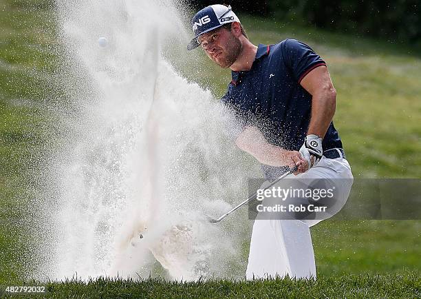 David Lingmerth of Sweden hits a shot from a sand trap on the eighth hole during the final round of the Quicken Loans National at the Robert Trent...