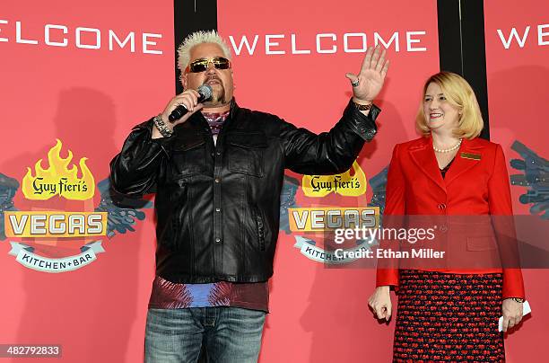 Chef and television personality Guy Fieri and Regional President of The Quad Resort & Casino Eileen Moore speak to guests during a welcome event for...