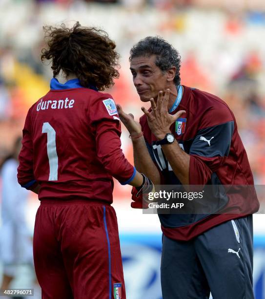 Italy's goalkeeper Francesca Dorante celebrate with a staff member after defeating Venezuela in their FIFA U-17 Women's World Cup Costa Rica 2014...