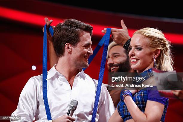 Alexander Klaws and Isabel Edvardsson smile while Massimo Sinato laughs during the 2nd Show of 'Let's Dance' on RTL at Coloneum on April 4, 2014 in...