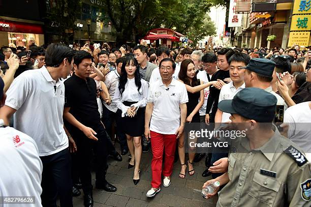 Seoul Mayor Park Won-soon and South Korean girl group miss A promote Seoul tourism on August 2, 2015 in Guangzhou, China.