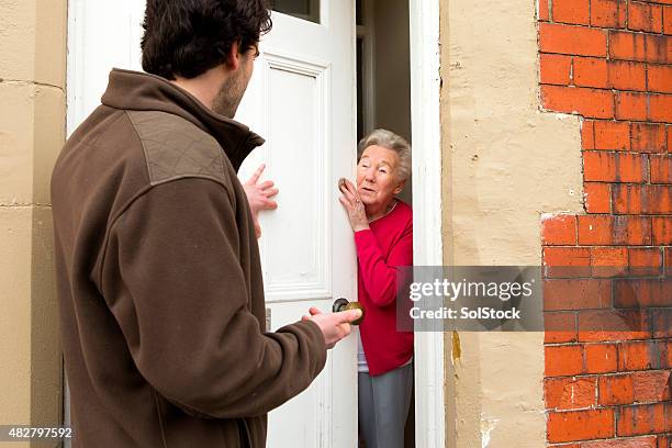 pushy salesman - door stock pictures, royalty-free photos & images