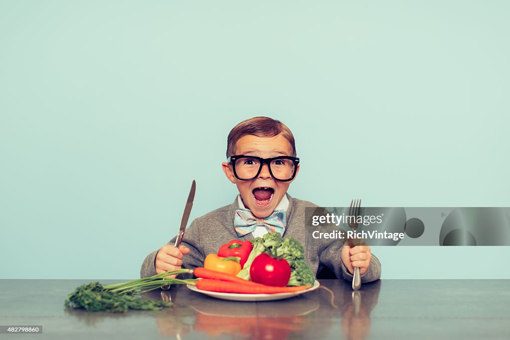 Young Nerd Boy Loves Eating Vegetables