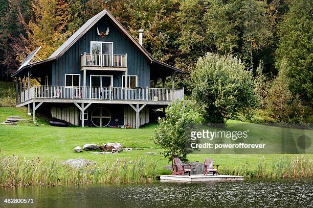 cottage by the lake - lake stock pictures, royalty-free photos & images