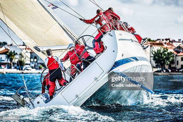 sailing crew on sailboat during regatta - regatta stock pictures, royalty-free photos & images