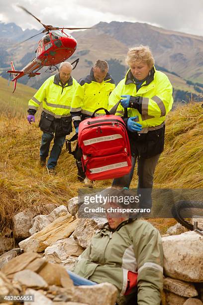 heli-rescue team - air ambulance stock-fotos und bilder