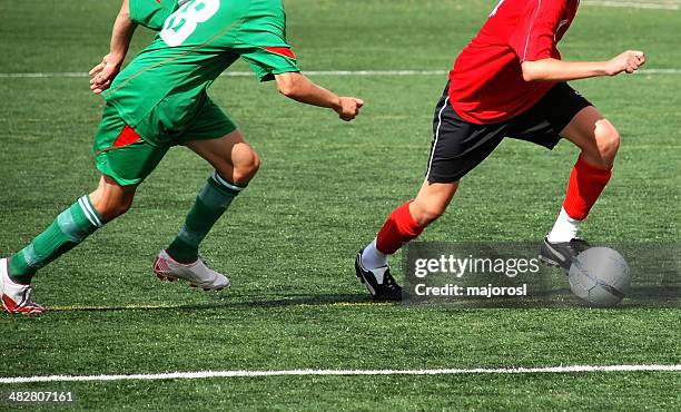 soccer players in action - shooting at goal 個照片及圖片檔