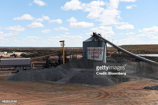 Silo stands next to a stockpile of copper ore at the Sandfire Resources NL copper operations at DeGrussa, Australia, on Sunday, Aug. 2, 2015....