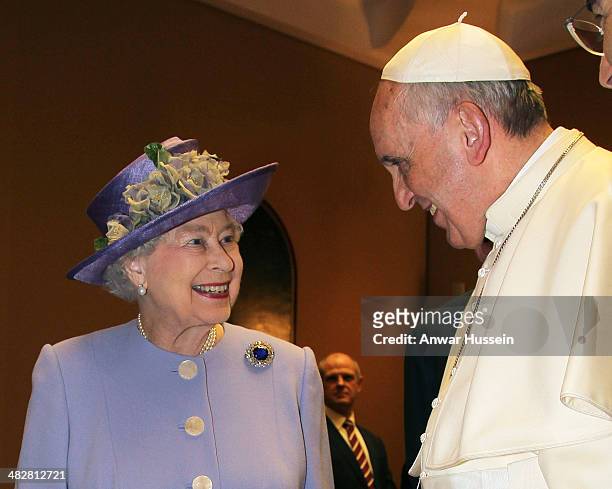 Queen Elizabeth ll smiles as she exchanges gifts with Pope Francis at The Vatican on April 03, 2014 in Vatican City, Italy.