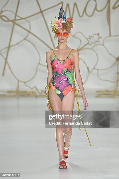 Model walks the runway during Amapo show at Sao Paulo Fashion Week Summer 2014/2015 at Parque Candido Portinari on April 4, 2014 in Sao Paulo, Brazil.