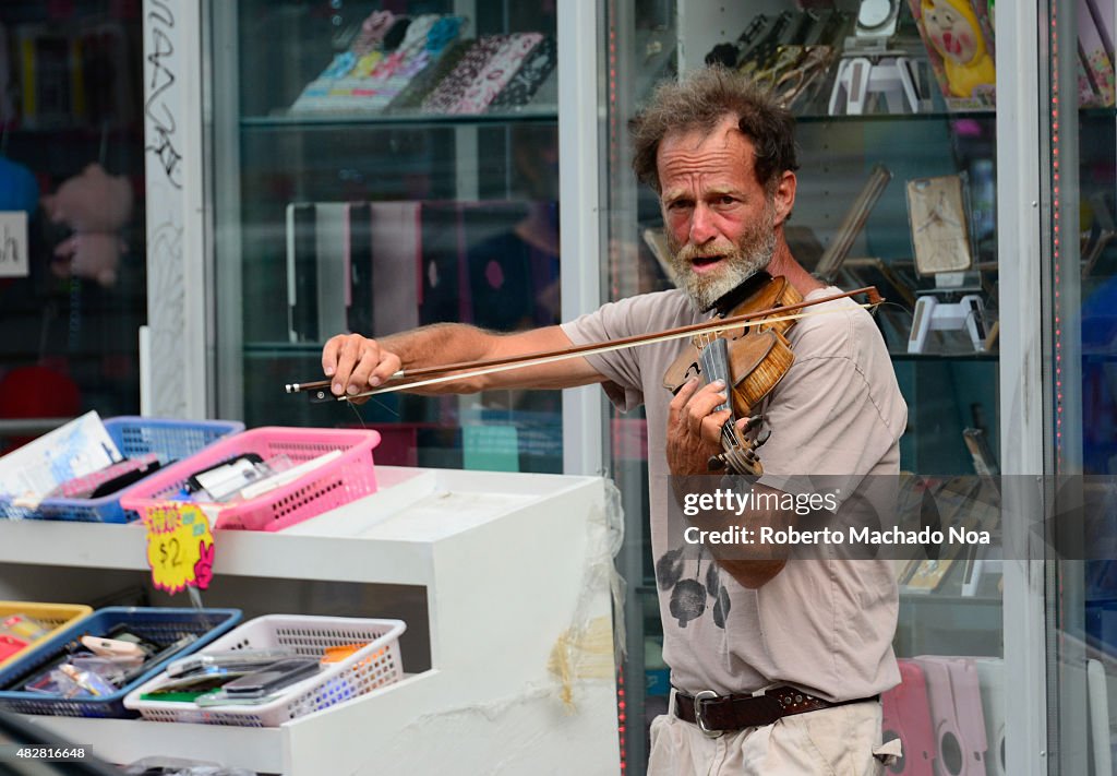 Violinist in the new Pedestrian Sundays celebration in...