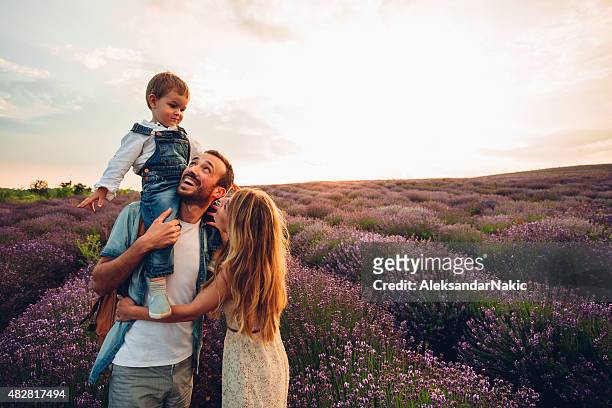 happy times - young family outdoors stockfoto's en -beelden